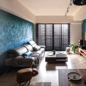 Modern Living Room with Leather Sofa and Artistic Blue Wall
