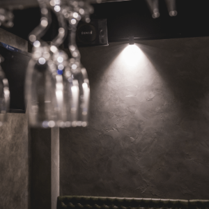 Wine Glasses Hanging Under Ambient Lighting