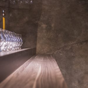 Bar Counter with Glasses and Cat in Background